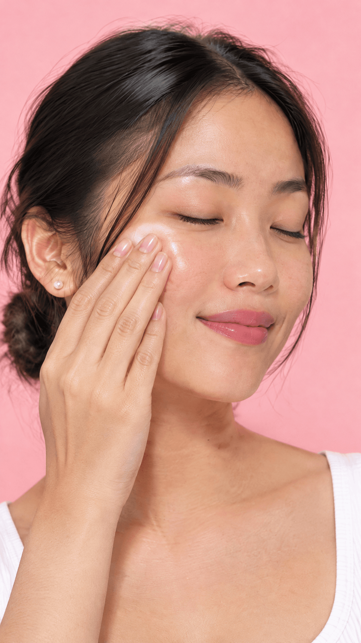 Woman patting Glow Recipe serum onto her cheekbone with three fingertips, made with GPT Image 2.5 Flare