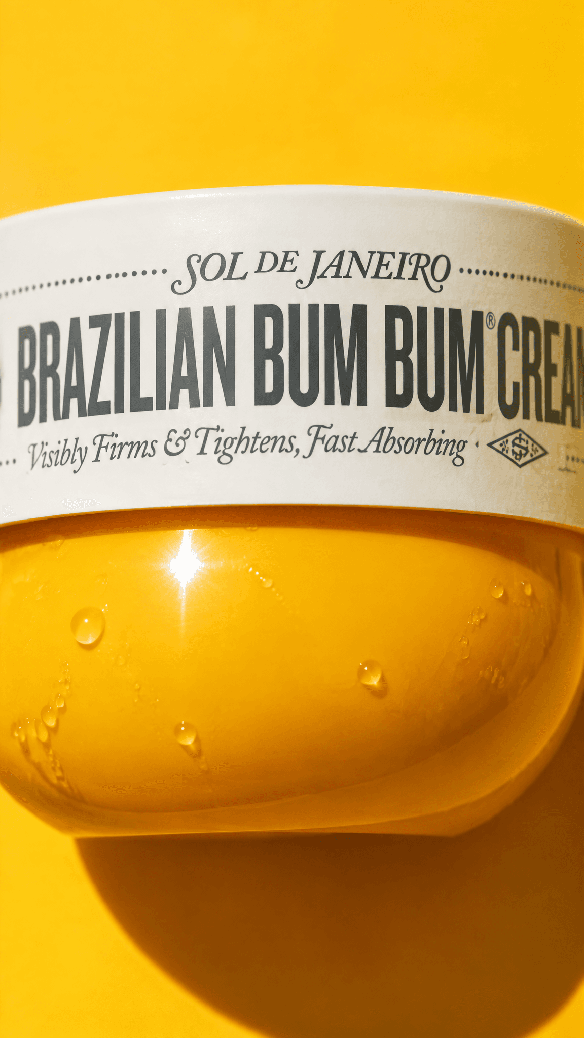 Close-up of the Sol de Janeiro lid band wordmark with sun glints, made with GPT Image 2.5 Flare