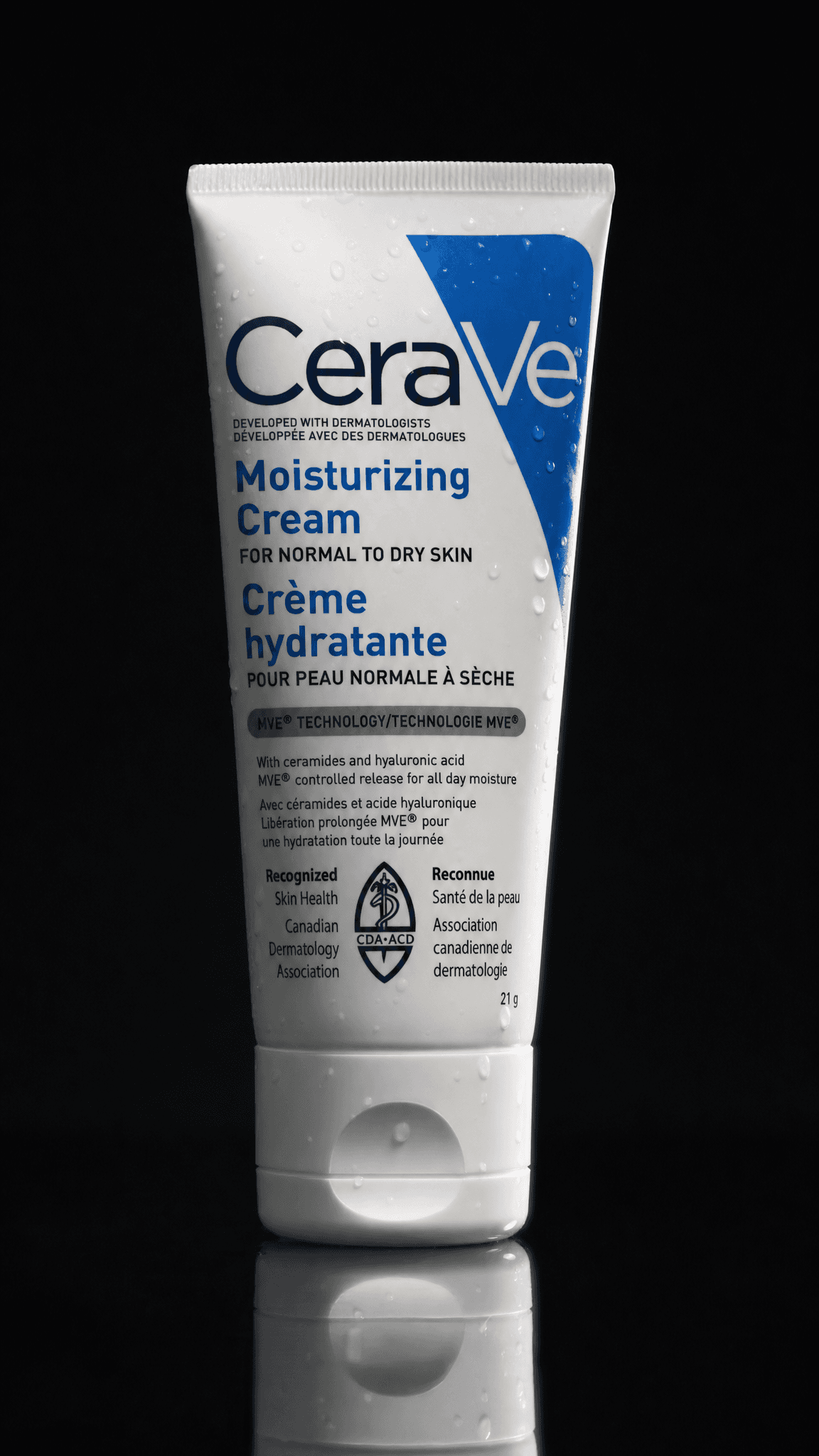 A white moisturizer tube on a near-black studio background with the label sharp and readable, made with GPT Image 2