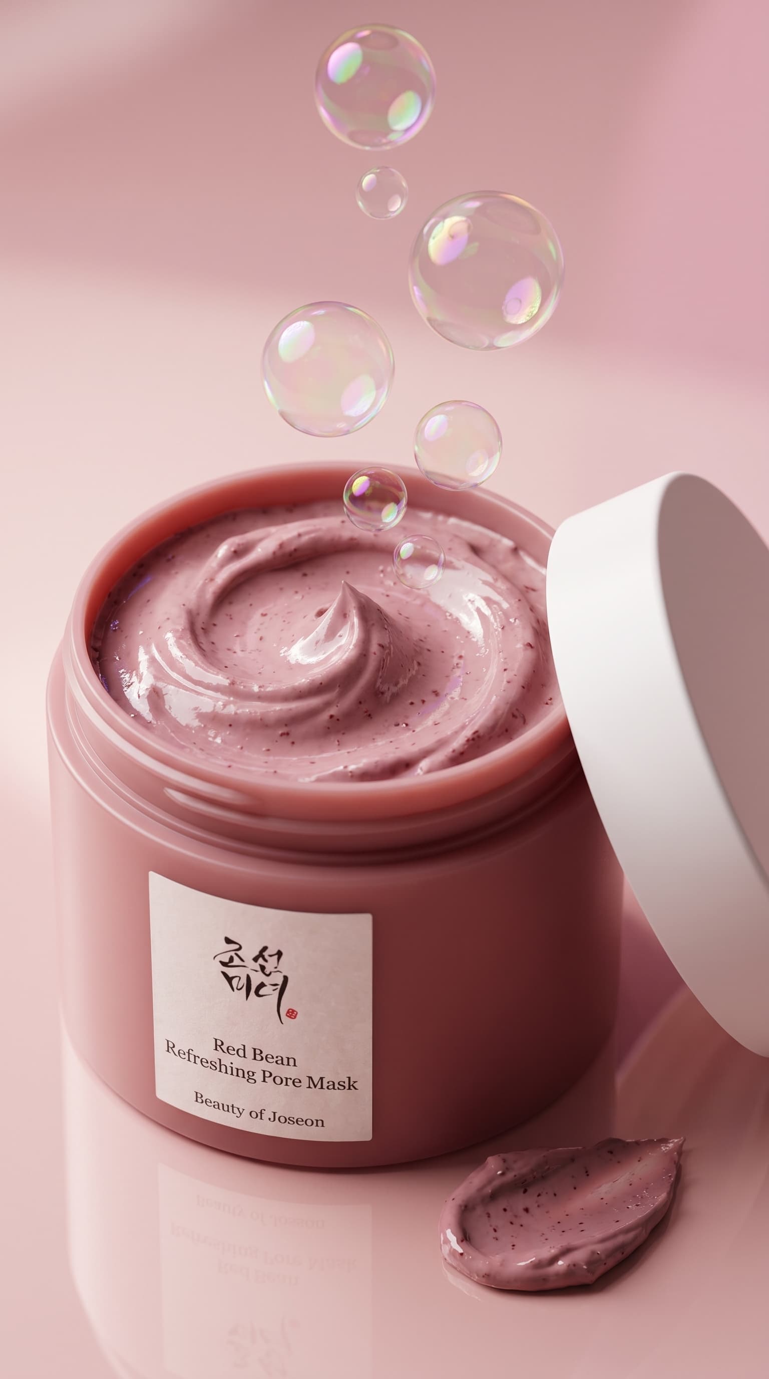 Open jar of speckled pink clay mask with soap bubbles rising out, made with Nano Banana Pro