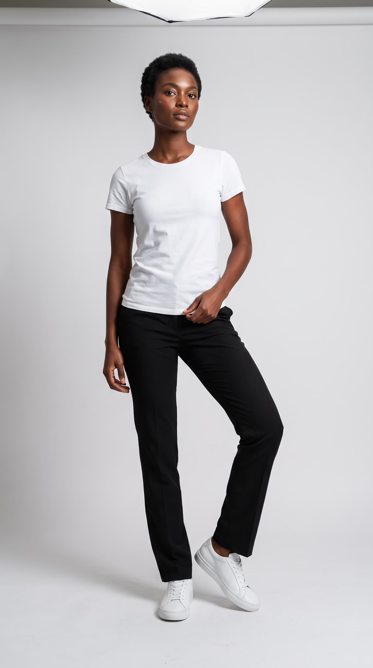 Model with short coils on grey paper with a studio softbox visible at the top of the frame, made with Nano Banana Pro