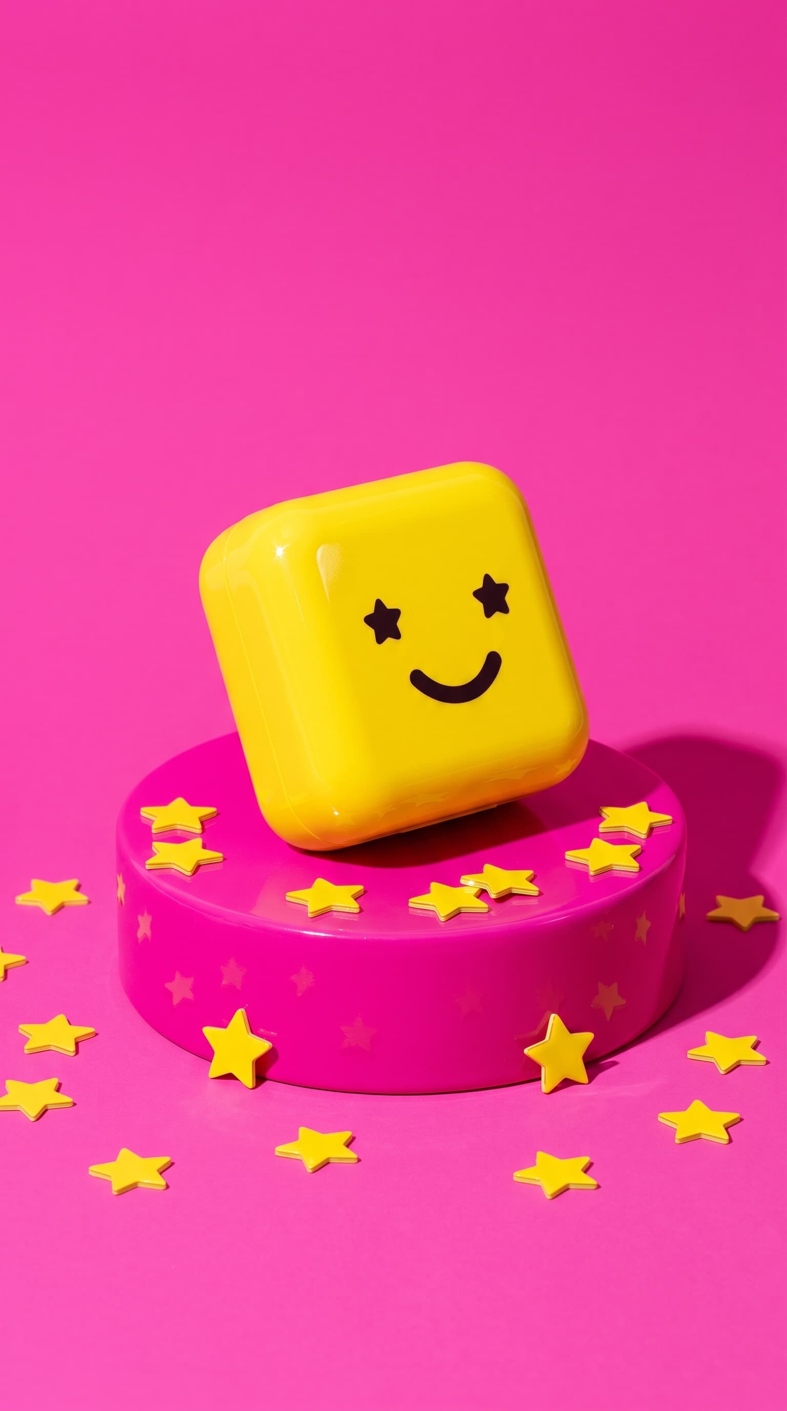 Yellow Starface compact on a glossy magenta plinth with yellow star confetti, made with Nano Banana Pro